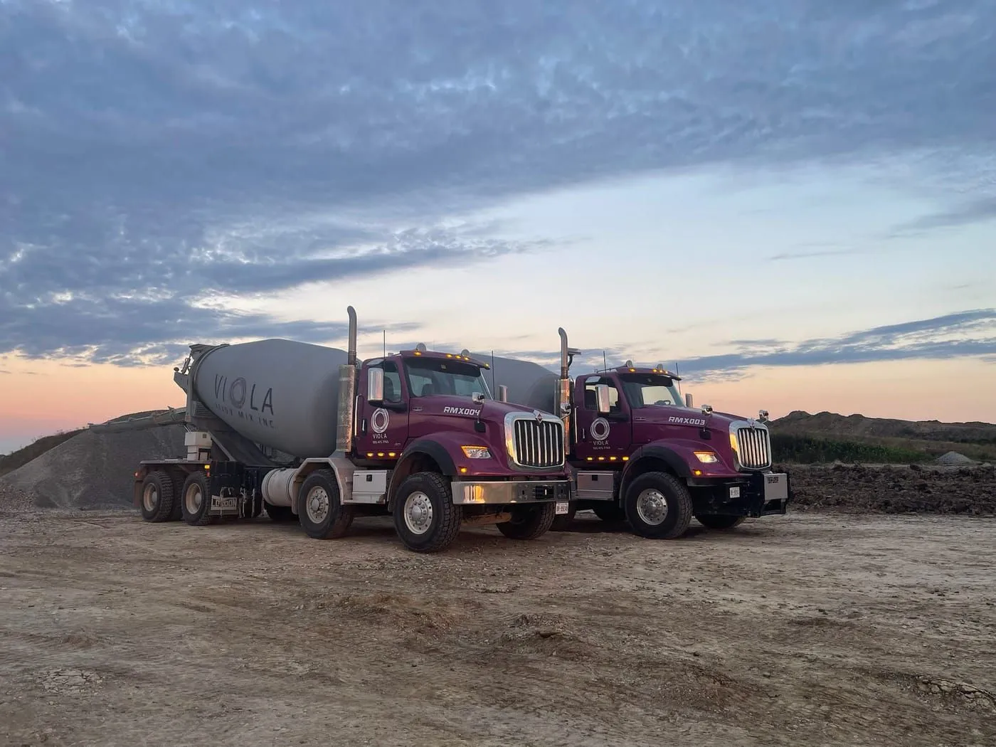 Ready mix mixer trucks at dusk